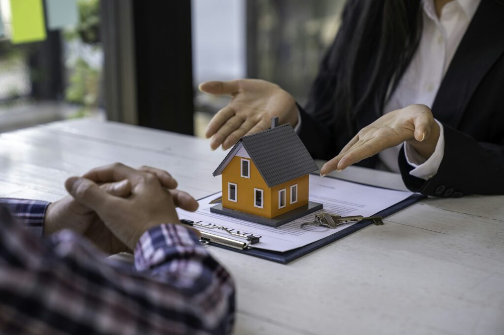 Real Estate Agent broker or House developer showing contract for buying house agreement to consultan